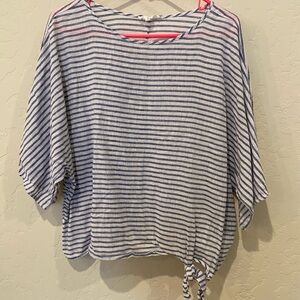 Oversized blue and white striped shirt.